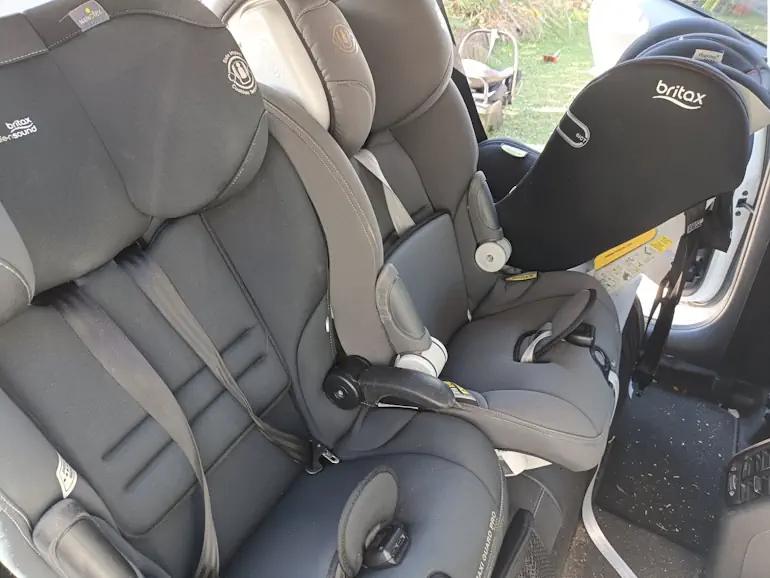 Three-across mix of Britax and Infa seats in a family car