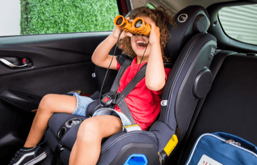Child in a car seat at the rear-facing shoulder height marker